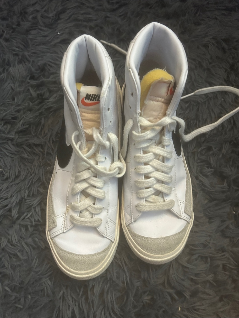 Nike White High-Top Sneakers with Black Swoosh